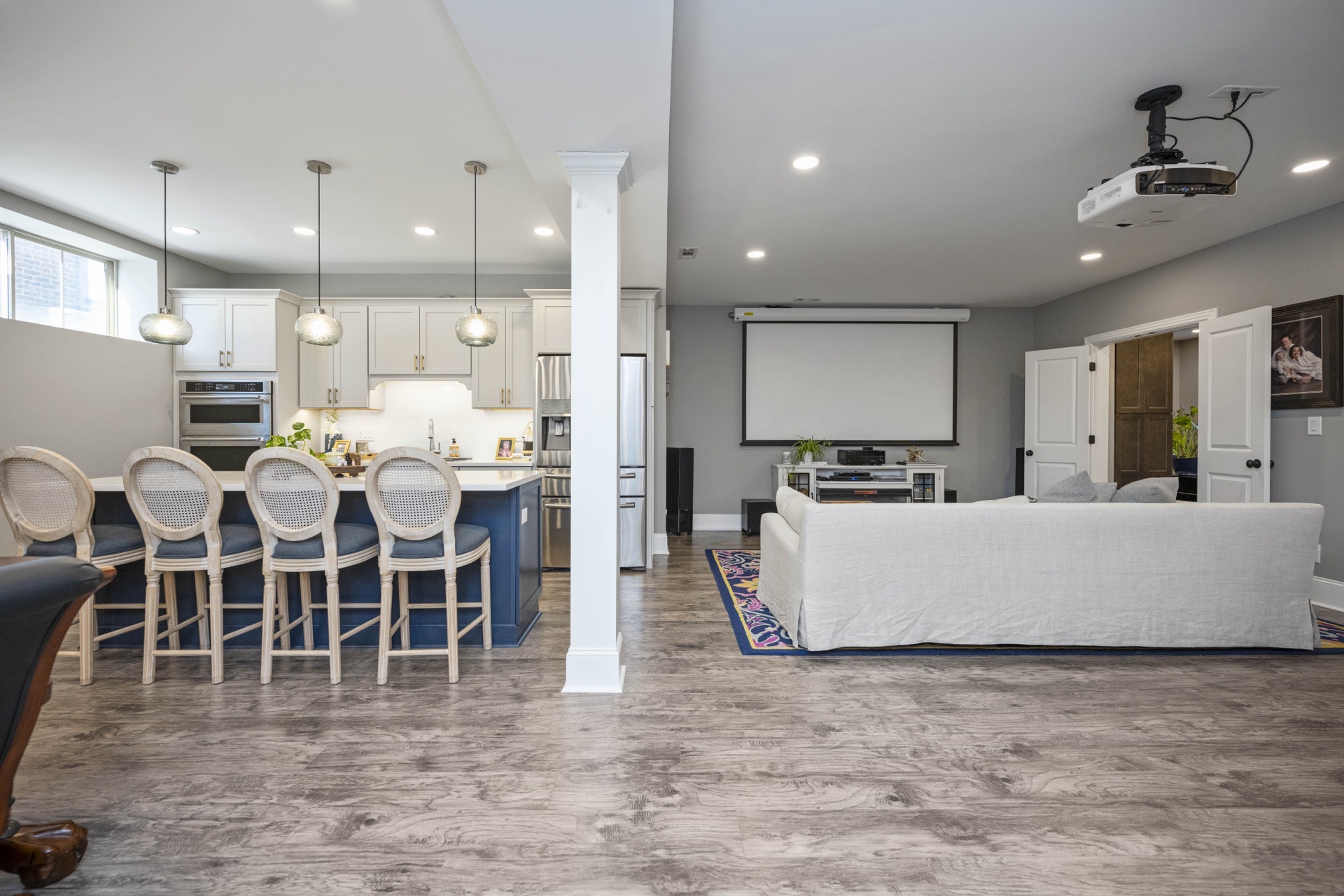 Locust Creek finished basement with kitchen bar and home theater seating