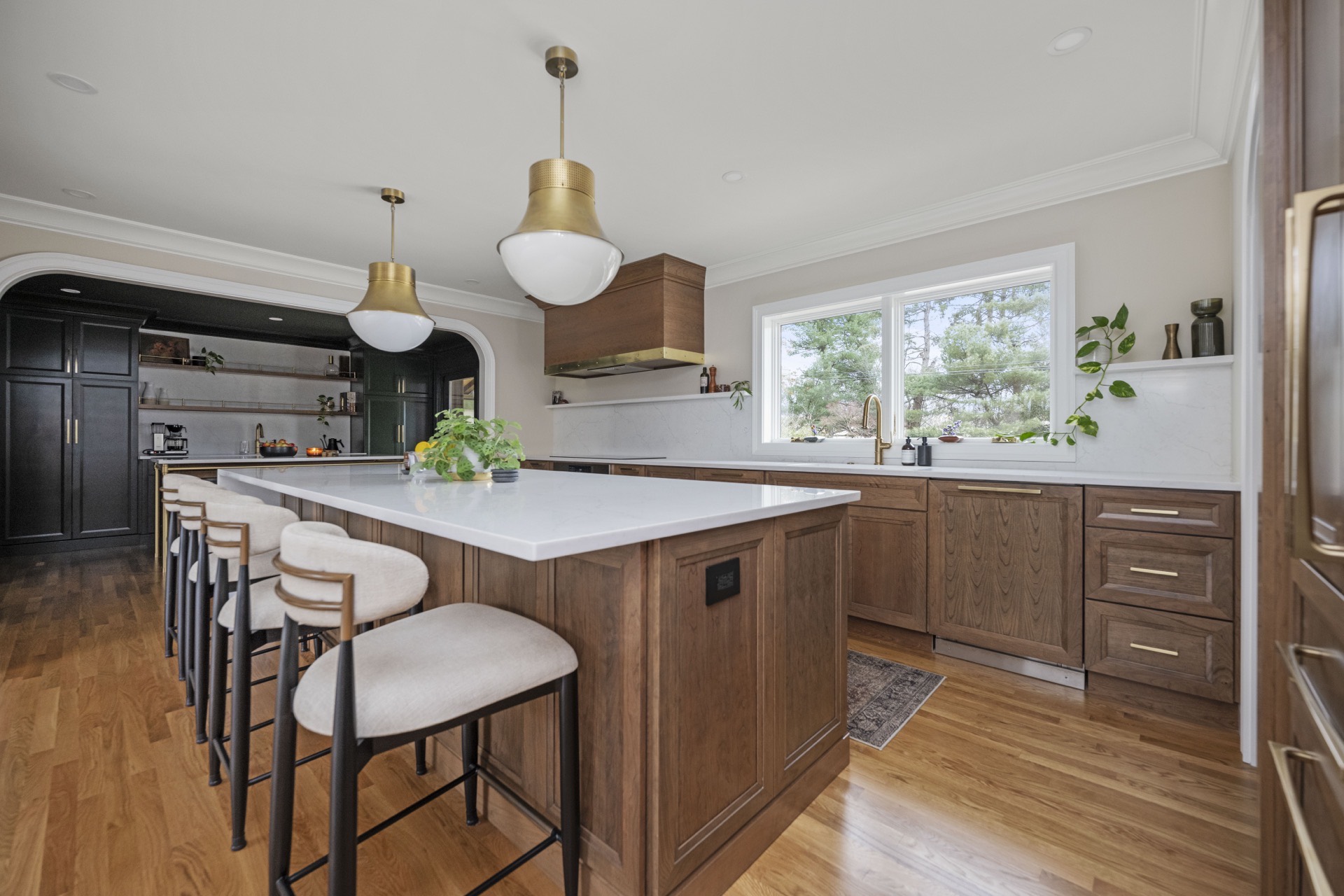 Athenia Drive kitchen with wood island and brass pendant lights